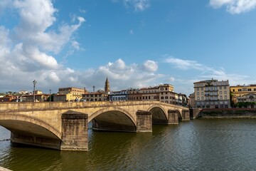 Fototapeta na wymiar View of Florence with the Arno river in the foreground