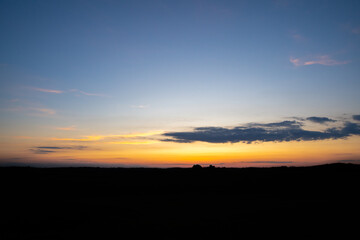 Evening sunset over a dark horizon in the country