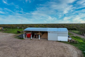 Shed in the middle of the field where tractors and agricultural machinery are kept