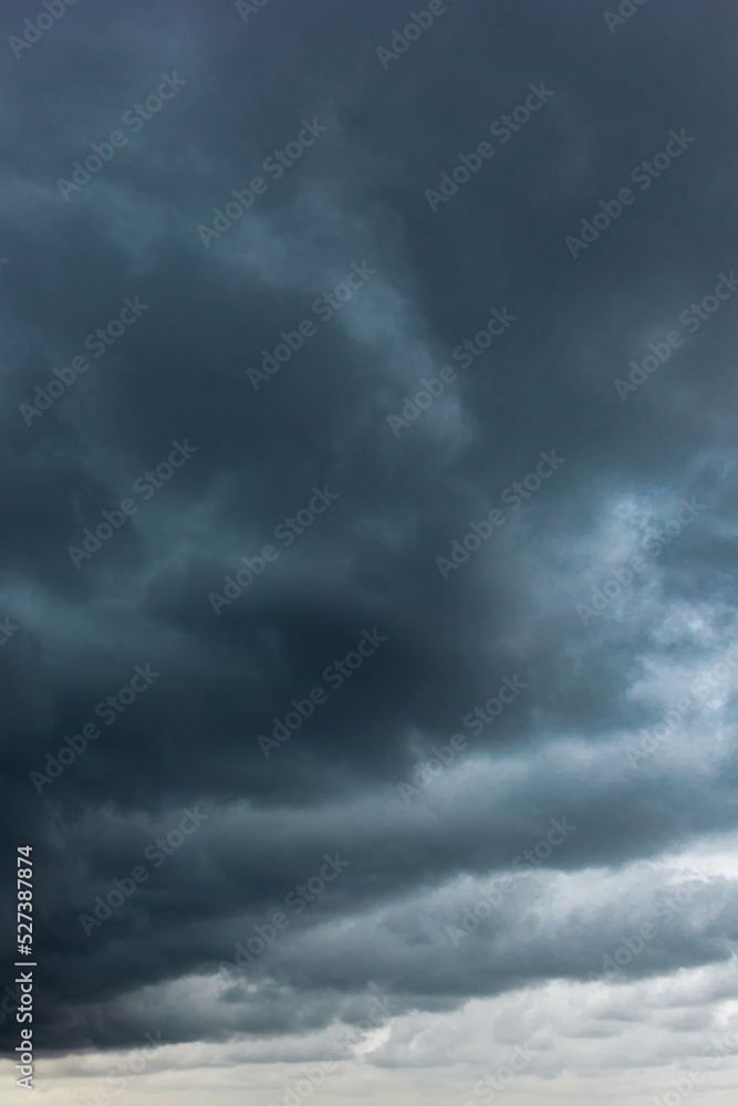 Aufkleber the dark sky with heavy clouds converging and a violent storm before the rain.bad weather sky.