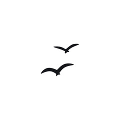 A flock of flying silhouette birds. Vector illustration