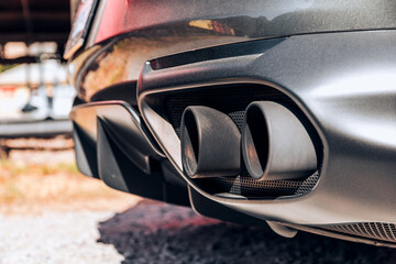 Side profile of a cars quad exhaust pipes