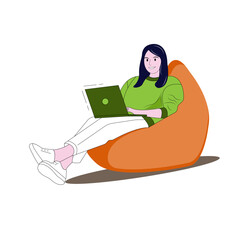 Work online, online training. A girl in a green sweatshirt and white pants sits with a green laptop in a bean bag.