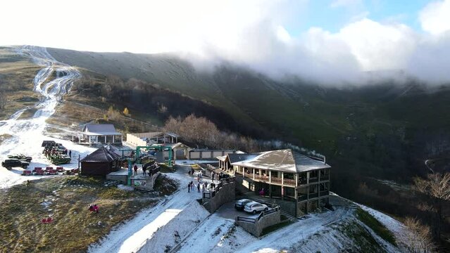 aerial view of travel landmark autumn mountains with snow