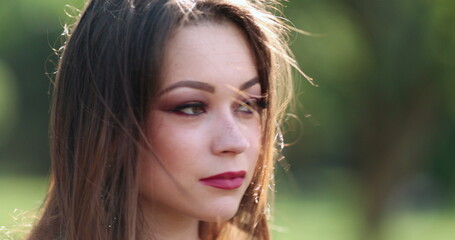 Young woman in her 20s headshot portrait in outdoors