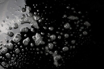Soap foam, bubbles isolated on black texture, with clipping path