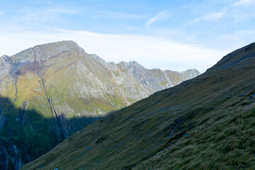 Impressive alpine view of high peaks in summer