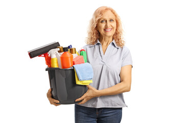 Woman holding a bucket with cleaning supplies and smiling
