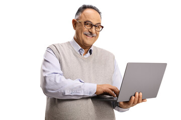 Cheerful mature man holding a laptop computer and looking at camera