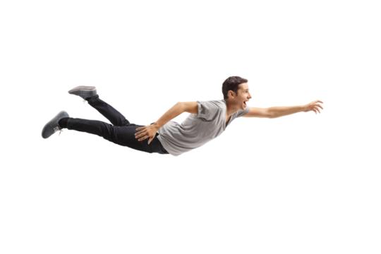 Casual young man flying and reaching for something