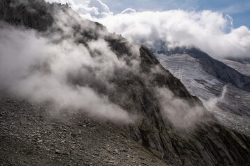 Alpine mountain peaks covered in clouds