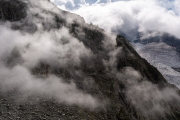 Alpine mountain peaks covered in clouds