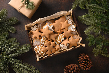 Christmas homemade cookies for festive holiday on brown background. View from above.