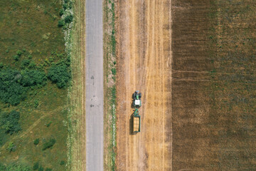 Fototapeta na wymiar Tractor On A Field. Aerial Top View. Organic Products Concept. Agriculture Industry.