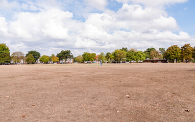 LONDON, ENGLAND - AUGUST 30, 2022: West Ham Park , London, Grass looking like straw due to the...