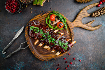 Barbecue pork ribs with sauce on the board