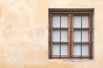Old house wall with wooden window