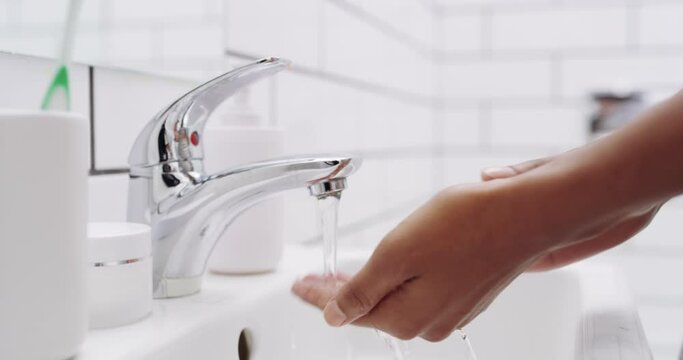 Woman and water for cleaning hands, help fight bacteria and germs in home bathroom closeup. Personal hygiene for black woman washing hands and using soap on hand, skin or palm for protection