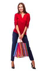 Portrait of young happy smiling pretty woman with shopping bags, isolated over white background