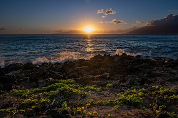 Scenic view of the cloudy sky and sunset over the pacific ocean on Maui beach, Hawaii