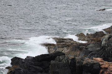 Ocean waves meeting a rocky shore