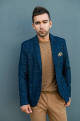 Young man posing in trendy autumn clothes
