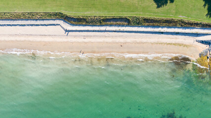 Aerial view on beach and coast of see in Helen's Bay, Northern Ireland. Drone shot sunny day 