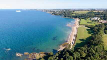 Aerial view on beach and coast of see in Helen's Bay, Northern Ireland. Drone shot sunny day 