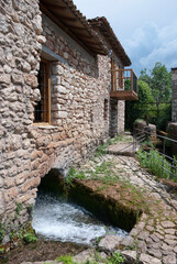 Fototapeta na wymiar Dimitsana, Greece / July 2022: The Open-Air Water Power Museum and Village near Loussios Gorge