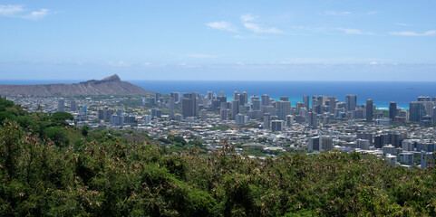 Fototapeta na wymiar Overlooking downtown Honolulu, Hawaii with Diamond Head in the distance.