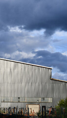 Fototapeta na wymiar Rain clouds over industrial building