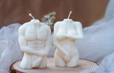 Soy handmade candles. Man and woman. Nude figures of male and female bodies. Intimacy concept. Decor