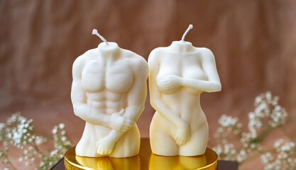 Soy handmade candles. Man and woman. Nude figures of male and female bodies. Intimacy concept. Decor