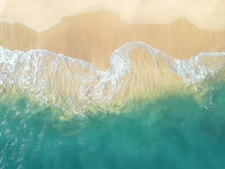 Foto auf Acrylglas An aerial view of a tropical sandy beach and blue ocean. © LUGOSTOCK