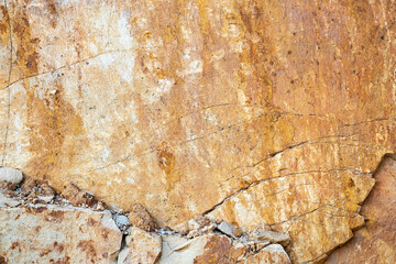 Texture of sandstone with many cracks, orange and white