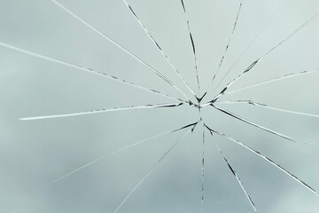 Crack on the glass against the sky, broken glass