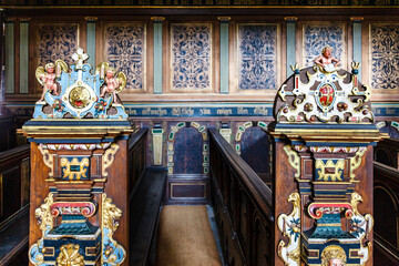 Pew with rich ornate  colorful woodwork in the chapel of Kronborg Slot castle in Helsingor, Denmark, Europe