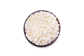 Cottage cheese in a brown bowl on a white isolated background