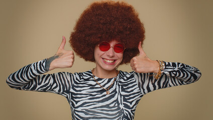 Like. Lovely pretty young woman raises thumbs up agrees with something or gives positive reply...