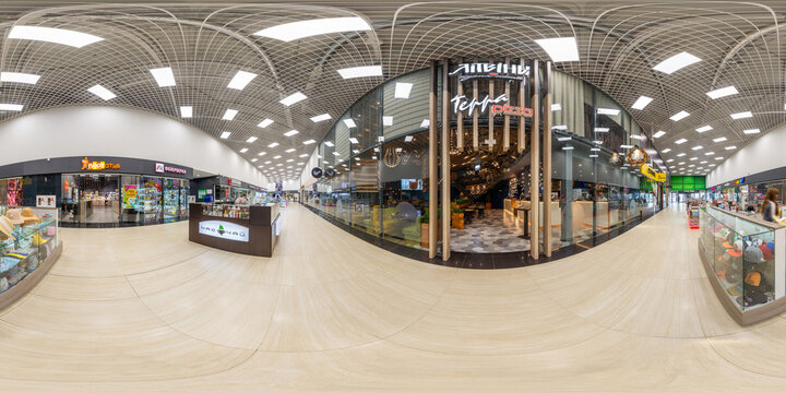 MINSK , BELARUS - 2021: Panorama in interior stylish modern trade centre. Full spherical 360 by 180 degrees seamless panorama. Pavilions of the shopping center with escalators