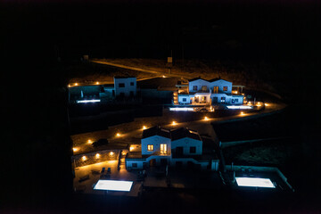 Night Shots Of Houses With Lights And Pools. Nice Contrasting Colours