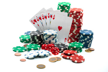 Studio shot composition of poker chips, dices, playing cards, coins and dollar banknotes isolated over white background