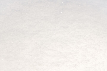 Winter snow. Snow texture Top view of the snow. Texture for design. Snowy white texture. Snowflakes.