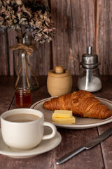 Food photography of breakfast, croissant, cappuccino, butter,  jam