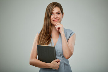Thinking teacher or female businessperon with book. Isolated portrait.