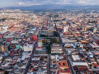 Fototapeta premium Beautiful aerial view of Guatemala City - Catedral Metropolitana de Santiago de Guatemala, the Constitution Plaza in Guatemala