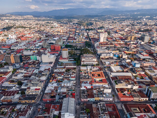Fototapeta premium Beautiful aerial view of Guatemala City - Catedral Metropolitana de Santiago de Guatemala, the Constitution Plaza in Guatemala