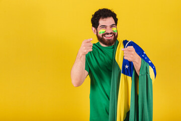 caucasian man with beard, brazilian, soccer fan from brazil, advising, suggesting, indicating,...
