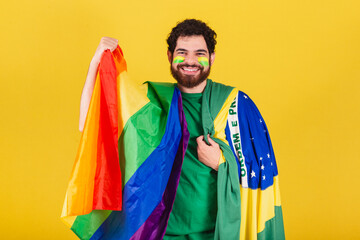 caucasian man with beard, brazilian, soccer fan from brazil, wearing lgbt flag,.concept of...