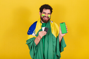 man, brazilian, bearded, soccer fan from brazil, holding credit card and cellphone, mobile apps,...